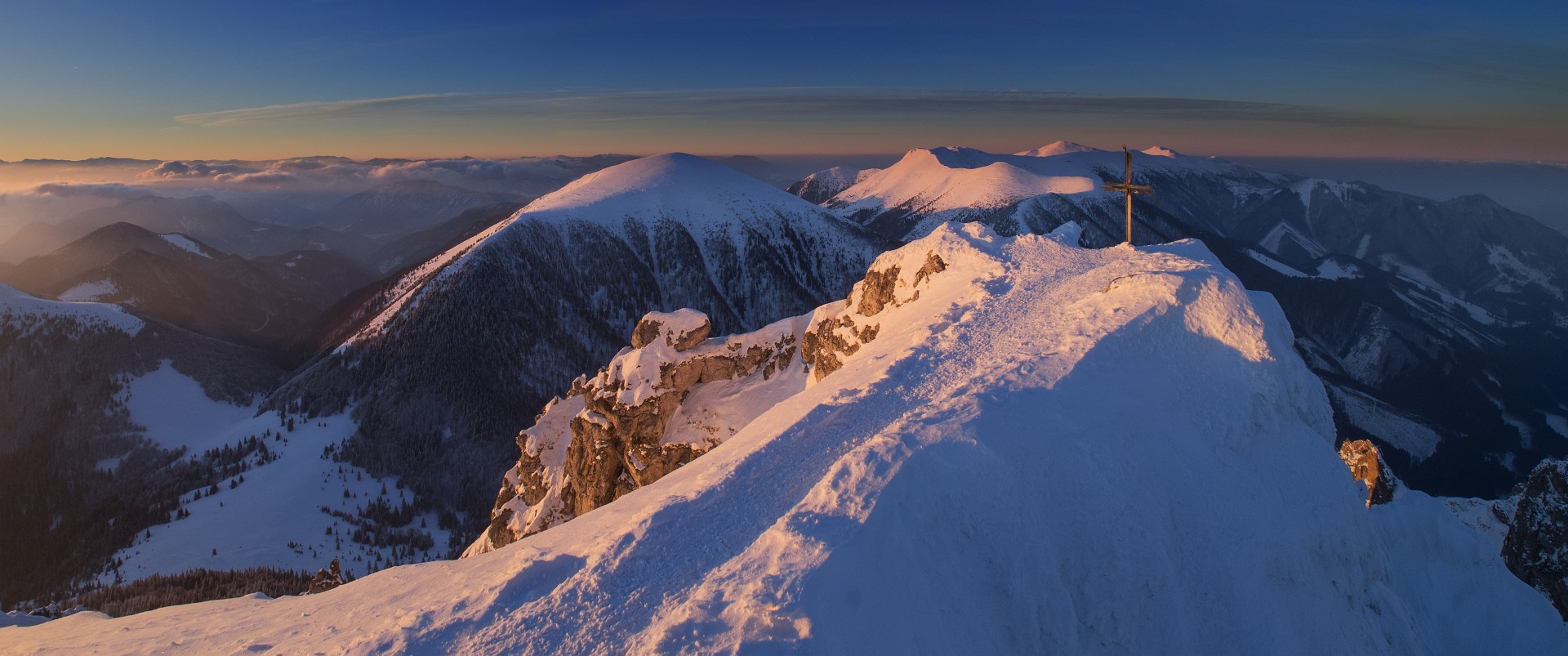 First rays of light at the top of Veľký Rozsutec